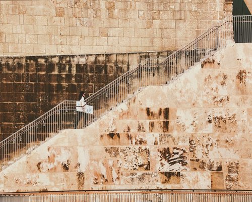person walking up the stairs instead of using elevator